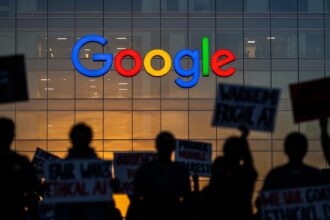 The Google logo with a protest sign in front of it, symbolizing that Google AI workers fired over working conditions.