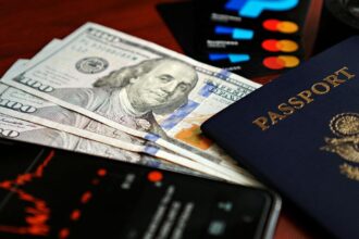 A key labeled TALENT being drawn towards Big Tech, symbolizing the disadvantage startups face due to the H-1B visa fee hike