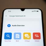 A smartphone displaying the new NotebookLM Audio Overviews formats: Brief, Critique, and Debate.